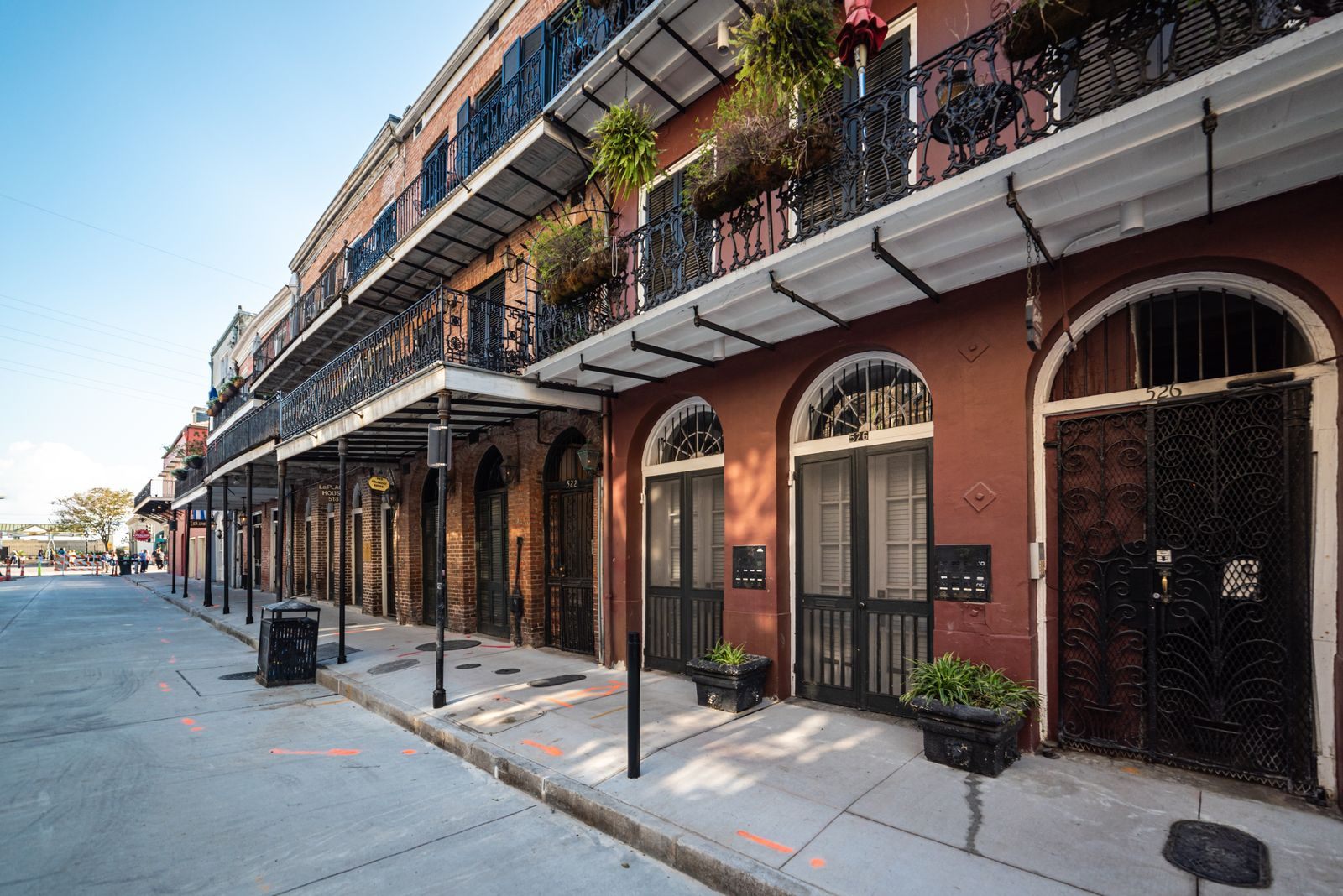 Iron-lace balconies on a historic French Quarter building, steps from where a Mississippi river cruise in New Orleans boards