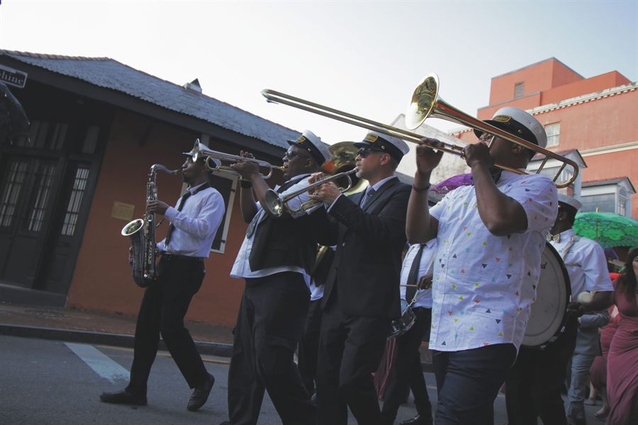 Brass band musicians performing on a New Orleans street
